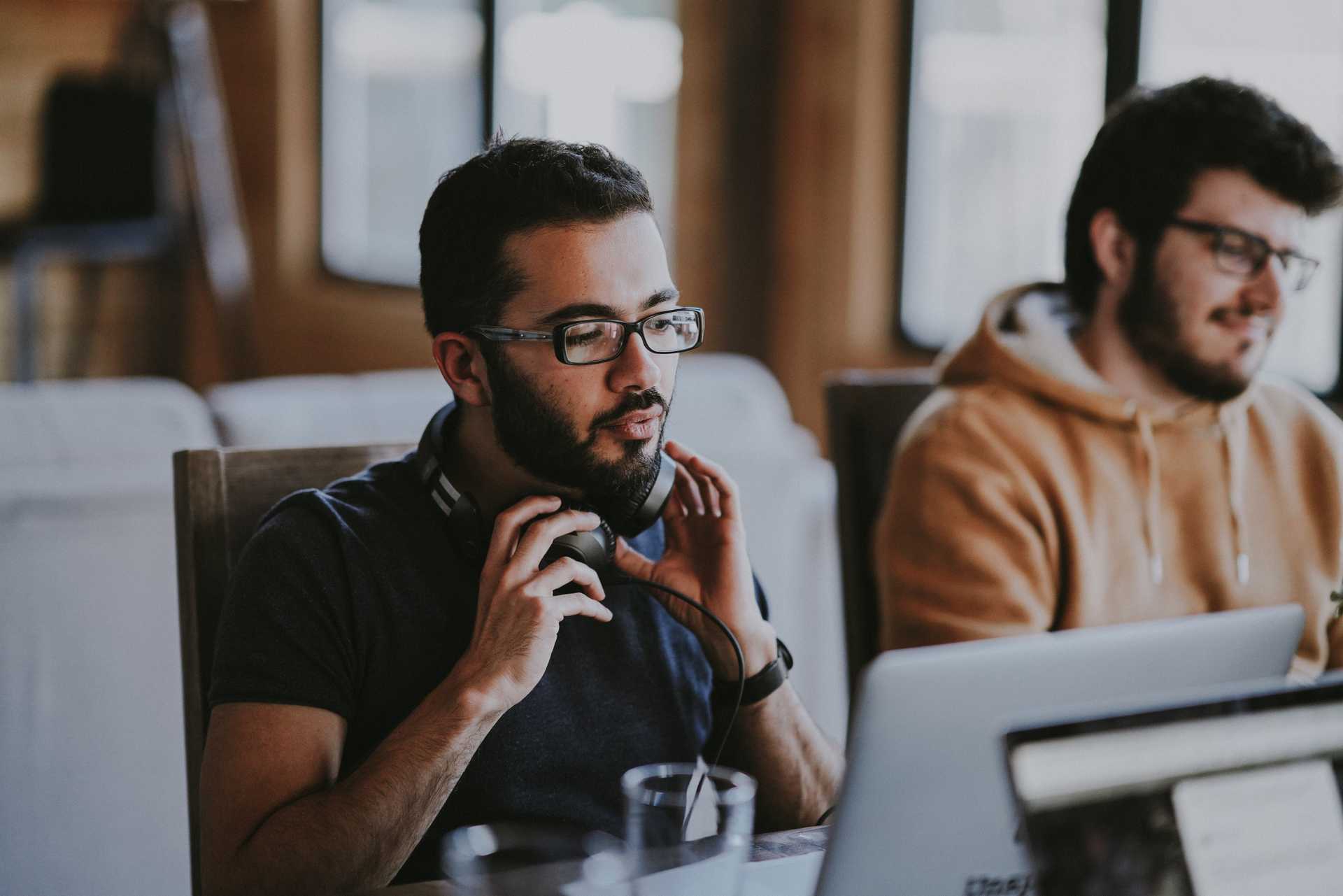 Two people sitting at computers